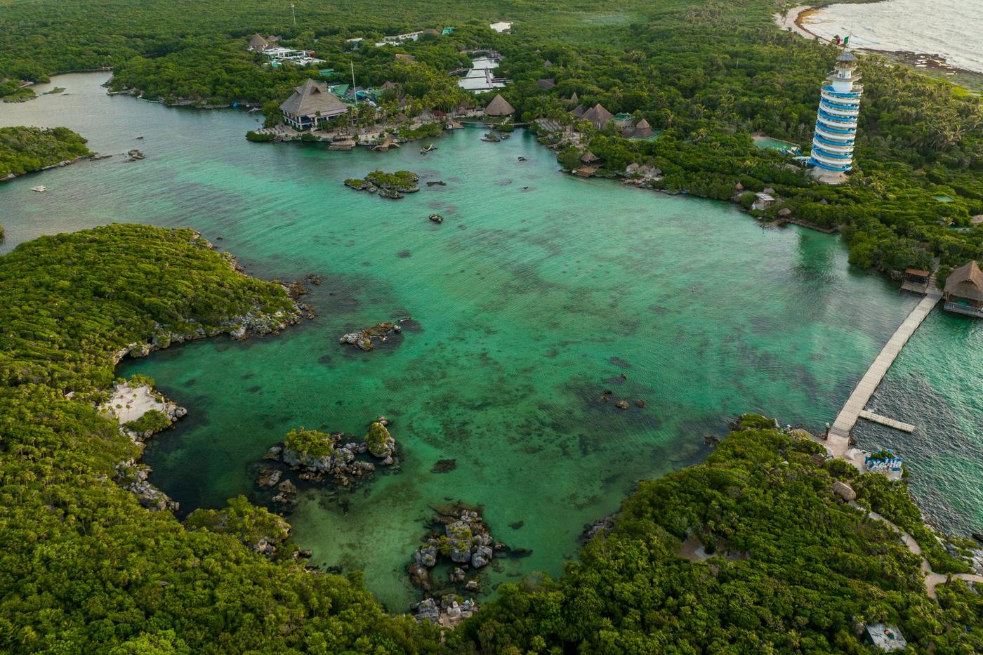 Aerial view of the Xel-Ha lagoon, its mangrove and its scenic lighthouse tower, Quintana Roo, Mexico